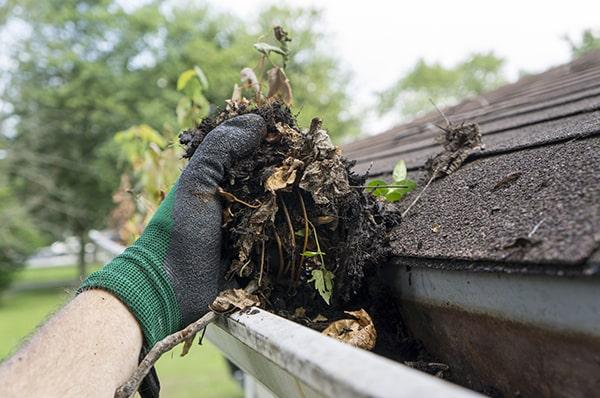 we use a combination of hand-cleaning and power washing for thorough gutter cleaning