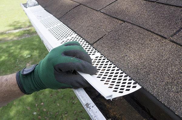 gutter guards are designed to allow water to flow into the gutter while keeping leaves and debris out